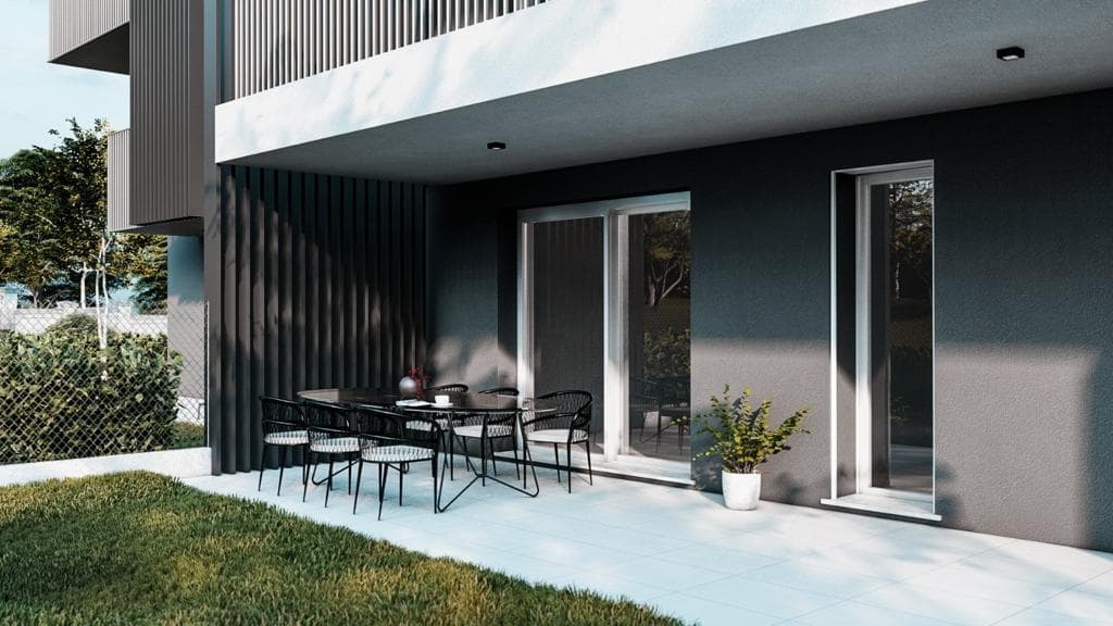 Residenza Superga a Cornate d’Adda: portico al piano terra con tavolo da pranzo e giardino